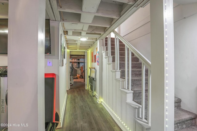 hallway with dark hardwood / wood-style floors