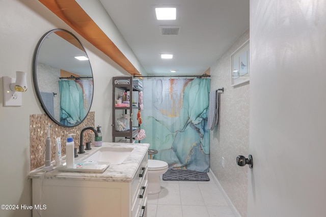 bathroom featuring toilet, curtained shower, vanity, and tile patterned floors