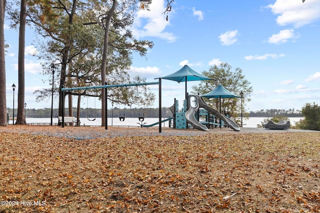 view of play area with a water view