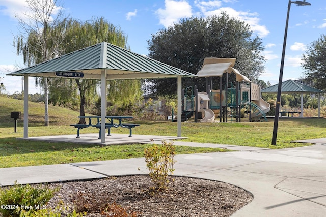 surrounding community featuring a playground, a lawn, and a gazebo