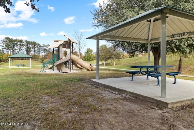 view of jungle gym with a lawn and a gazebo