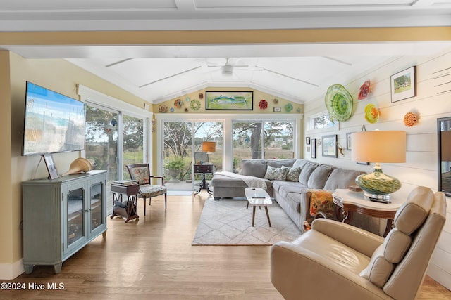 sunroom with lofted ceiling and ceiling fan