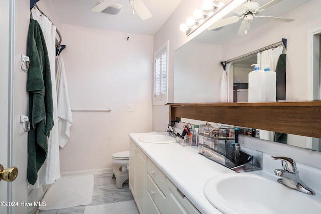 bathroom with vanity, toilet, and ceiling fan