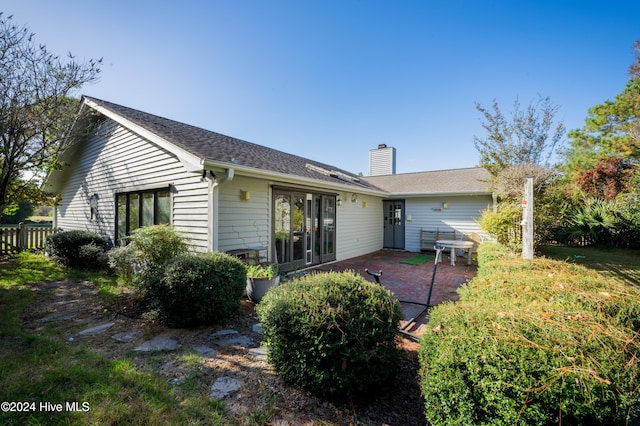 rear view of house featuring a patio area