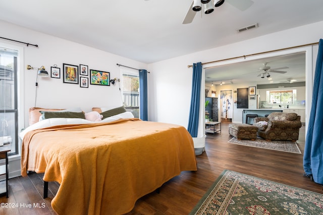 bedroom featuring ceiling fan and dark hardwood / wood-style floors