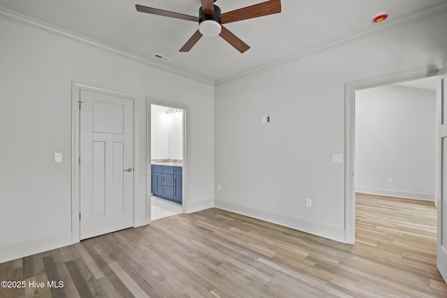 1552 Windsong Dr SW, Ocean Isle Beach, NC 28469 - empty room featuring a ceiling fan, ornamental molding, light wood finished floors, and baseboards
