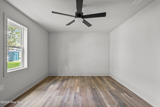 1552 Windsong Dr SW, Ocean Isle Beach, NC 28469 - empty room featuring wood finished floors, baseboards, and ceiling fan