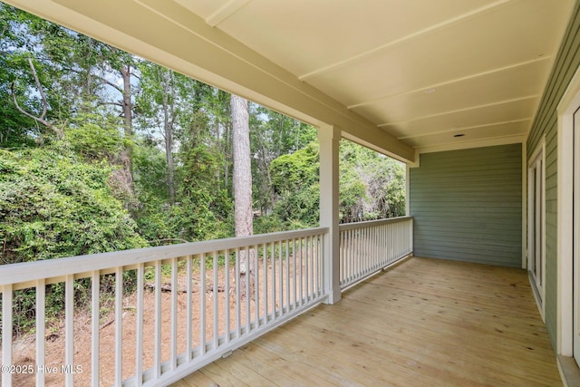 1552 Windsong Dr SW, Ocean Isle Beach, NC 28469 - wooden deck with view of scattered trees