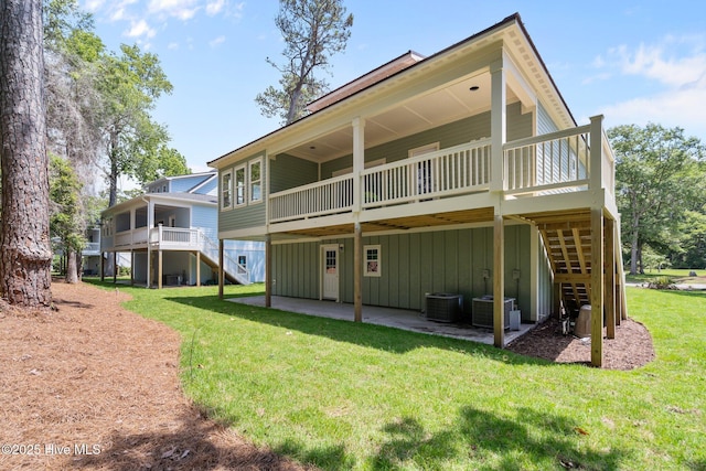 1552 Windsong Dr SW, Ocean Isle Beach, NC 28469 - rear view of property with stairs, a wooden deck, and a patio area
