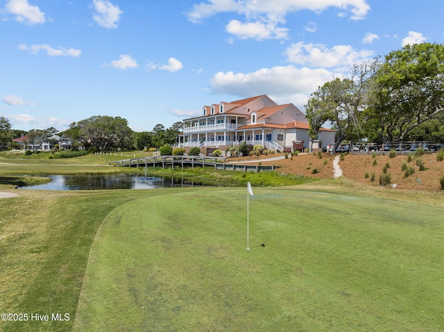 1552 Windsong Dr SW, Ocean Isle Beach, NC 28469 - view of property's community featuring a water view, an area to practice putting, and golf course view