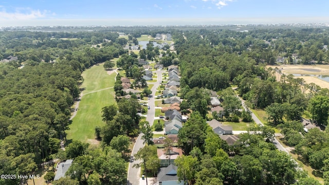 1552 Windsong Dr SW, Ocean Isle Beach, NC 28469 - aerial overview of property's location featuring a golf course, nearby suburban area, and a large body of water