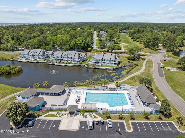 1552 Windsong Dr SW, Ocean Isle Beach, NC 28469 - aerial view of a pool, a large body of water, and a forest