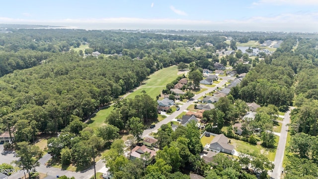 1552 Windsong Dr SW, Ocean Isle Beach, NC 28469 - aerial view of residential area featuring a heavily wooded area and a large body of water