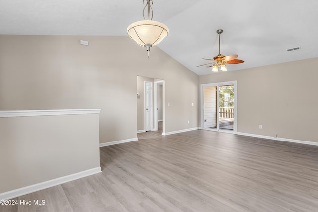 spare room with ceiling fan, light hardwood / wood-style floors, and lofted ceiling