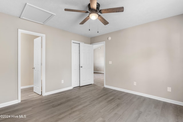 unfurnished bedroom featuring light hardwood / wood-style flooring and ceiling fan