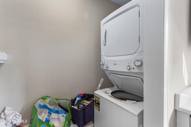 washroom with stacked washer and clothes dryer