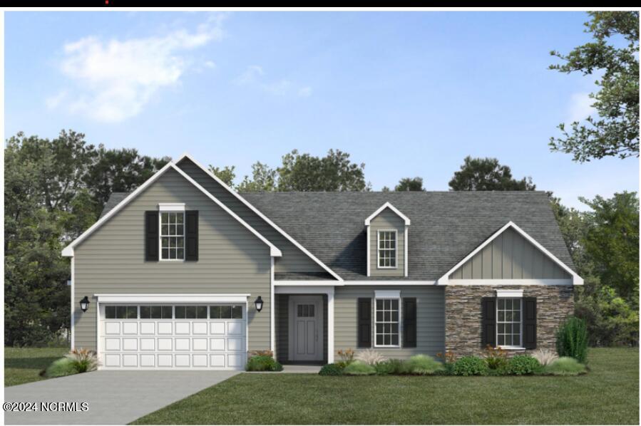 view of front facade featuring a garage and a front lawn