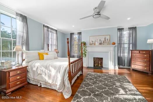 bedroom featuring hardwood / wood-style floors and ceiling fan