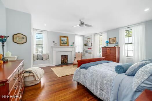 bedroom featuring ceiling fan and dark hardwood / wood-style floors