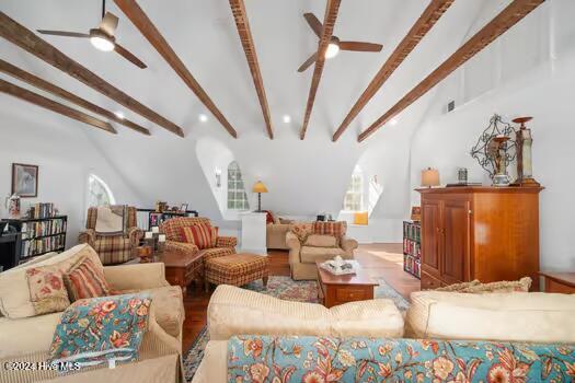 living room featuring ceiling fan, beam ceiling, high vaulted ceiling, and wood-type flooring