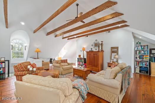 living room with hardwood / wood-style floors and lofted ceiling with beams