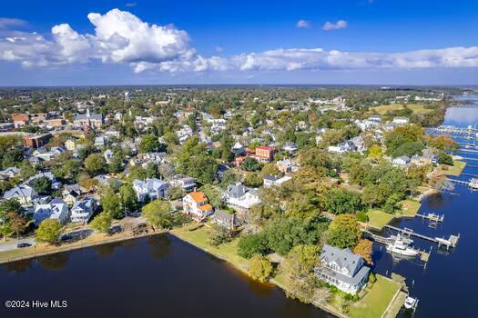 birds eye view of property with a water view