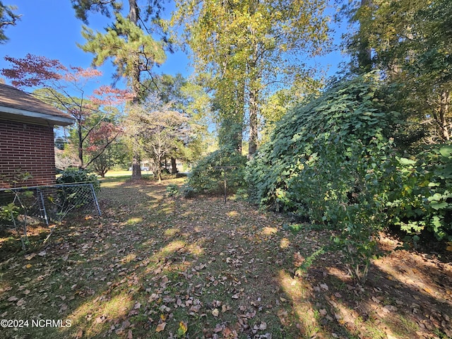 view of yard with fence