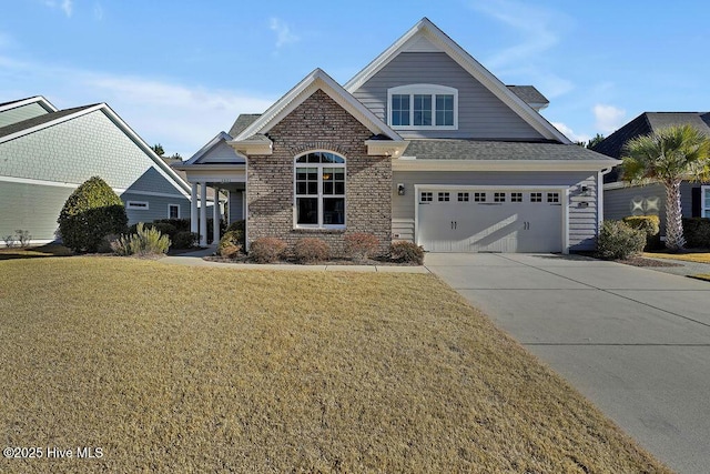 view of front of property with a garage and a front yard