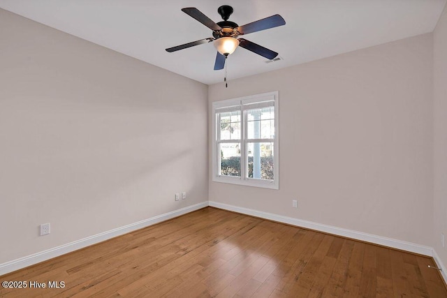 spare room featuring ceiling fan and light hardwood / wood-style floors