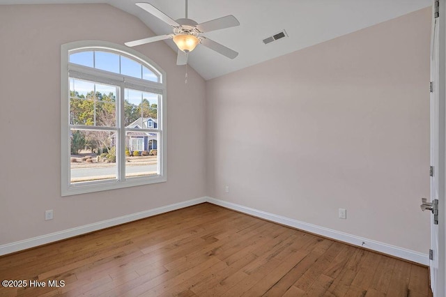 unfurnished room featuring lofted ceiling, ceiling fan, and light wood-type flooring