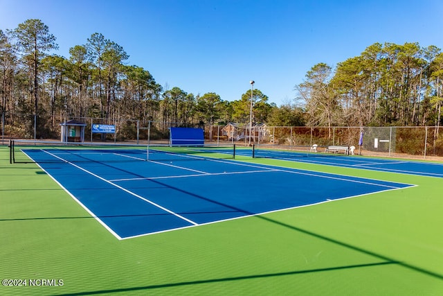 view of sport court featuring basketball hoop