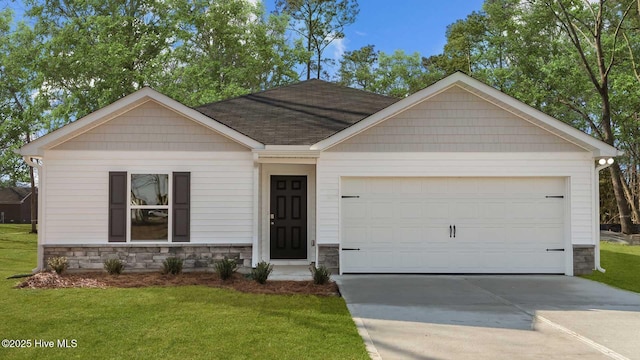 view of front facade with stone siding, an attached garage, driveway, and a front yard