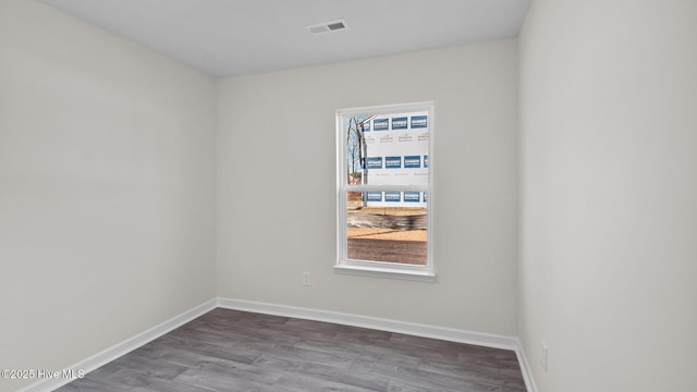 spare room with plenty of natural light, visible vents, and baseboards