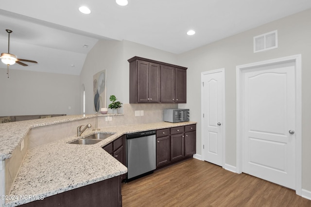 6639 Ramsey St, Fayetteville, NC 28311 - kitchen with appliances with stainless steel finishes, wood finished floors, dark brown cabinets, a ceiling fan, and vaulted ceiling