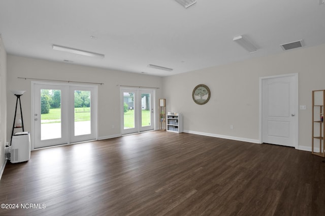 6639 Ramsey St, Fayetteville, NC 28311 - unfurnished living room featuring french doors, dark wood-type flooring, and healthy amount of natural light