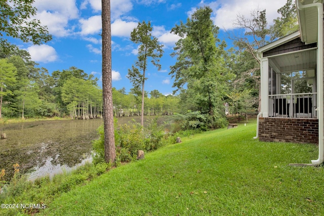 6639 Ramsey St, Fayetteville, NC 28311 - view of green lawn with a sunroom