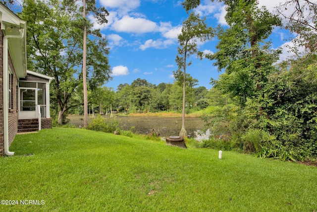 6639 Ramsey St, Fayetteville, NC 28311 - view of green lawn with a sunroom