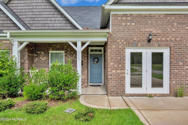 6639 Ramsey St, Fayetteville, NC 28311 - view of exterior entry with brick siding and french doors