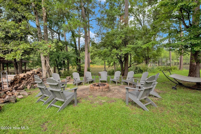 6639 Ramsey St, Fayetteville, NC 28311 - view of grassy yard featuring a fire pit and view of scattered trees