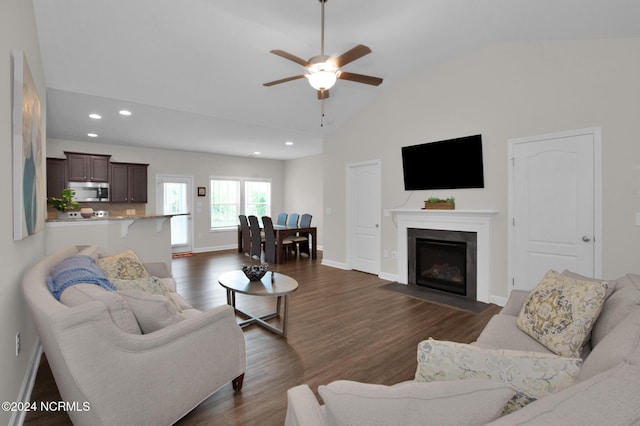6639 Ramsey St, Fayetteville, NC 28311 - living room with lofted ceiling, ceiling fan, dark wood-style flooring, recessed lighting, and a fireplace with flush hearth