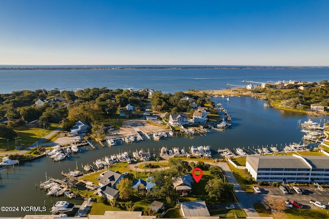 birds eye view of property featuring a water view