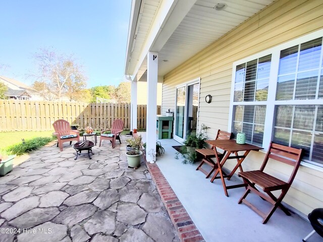 view of patio / terrace with a fire pit