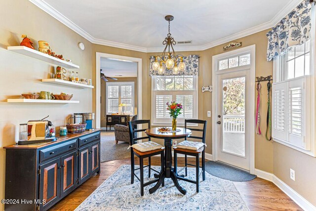 154 Horizon Trl, Aberdeen, NC 28315 - dining area featuring healthy amount of natural light, ornamental molding, wood finished floors, and baseboards
