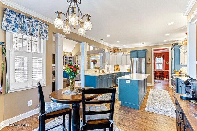 154 Horizon Trl, Aberdeen, NC 28315 - dining area featuring ornate columns, crown molding, baseboards, light wood-style floors, and recessed lighting