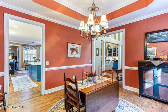 154 Horizon Trl, Aberdeen, NC 28315 - dining room with a chandelier, wood finished floors, ornamental molding, and baseboards