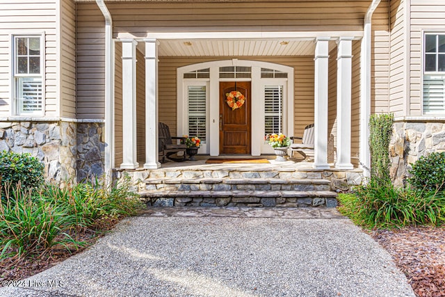 property entrance featuring covered porch