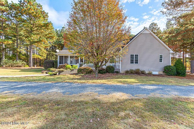 154 Horizon Trl, Aberdeen, NC 28315 - obstructed view of property with a front lawn and a porch