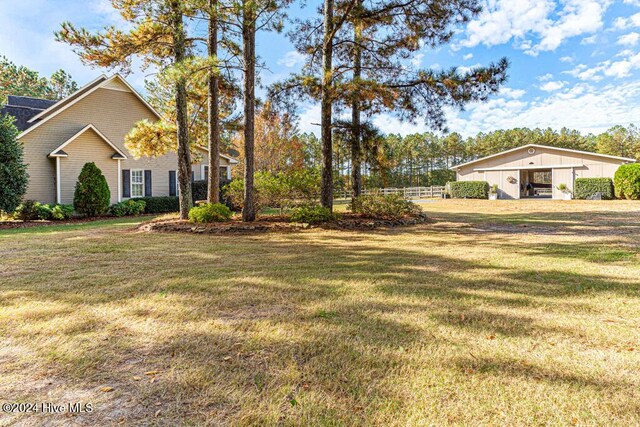 154 Horizon Trl, Aberdeen, NC 28315 - view of yard with a pole building and an outdoor structure