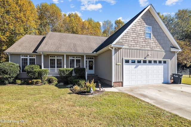 view of front of property with a front lawn and a garage