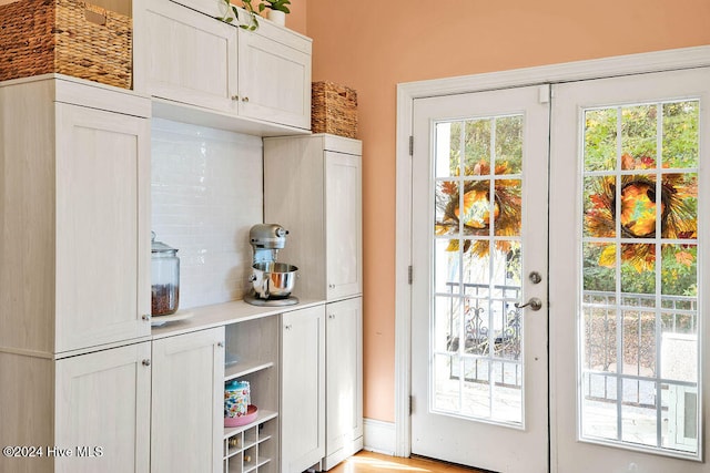 doorway to outside featuring french doors and light hardwood / wood-style floors